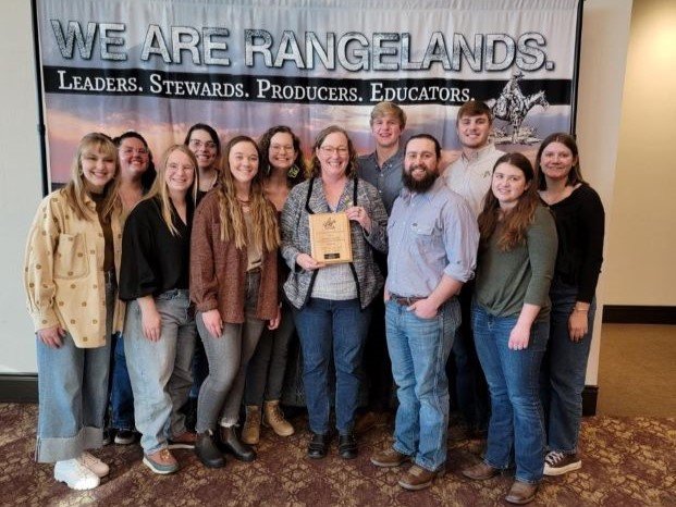 Range Team Poses with their 2nd place trophy in the URME Exam at the 2023 Range Conference.
