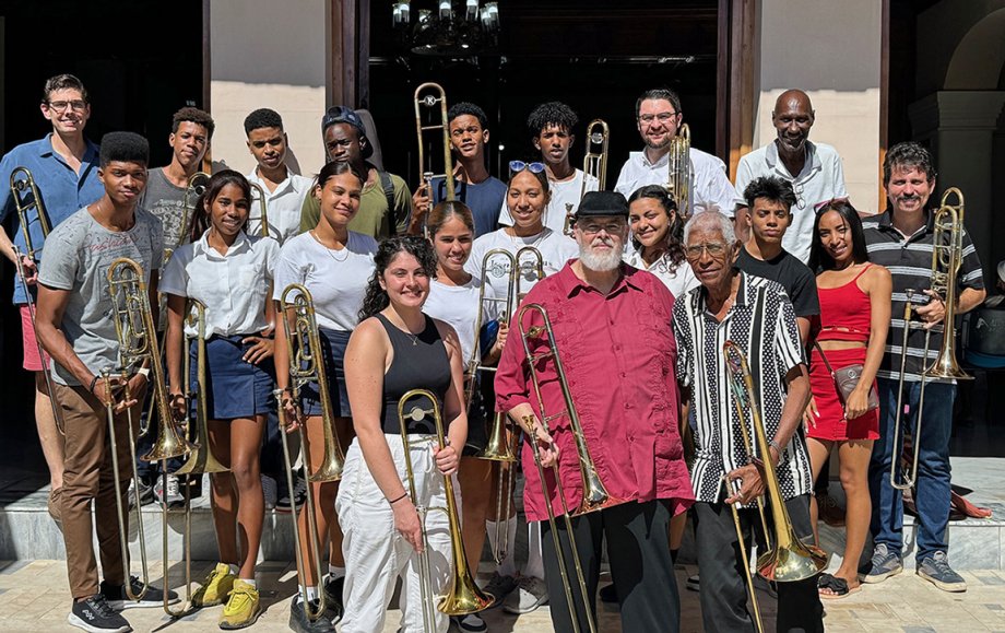 Trombonists from the United States gather with Cuban students and teachers at the Esteban Salas Conservatory after the U.S. musicians presented their informal concert and master class. Bradley Snyder, instructor of low brass at South Dakota State University, is shown in the back row, second from right.