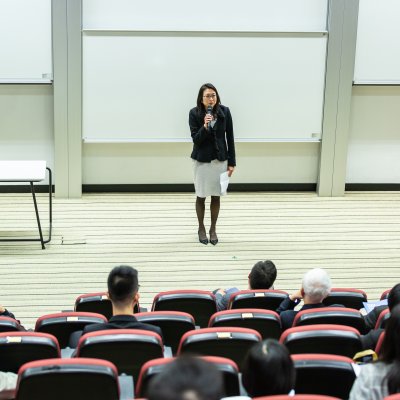 Woman standing in front of students