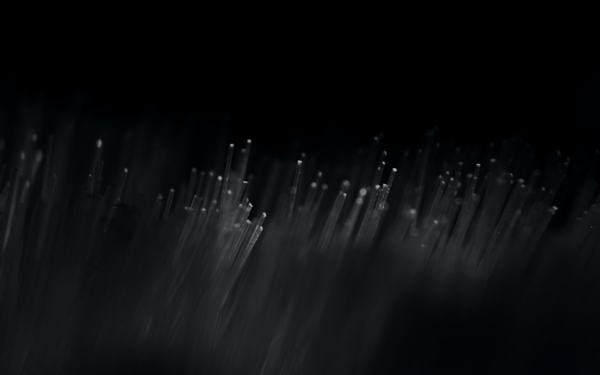 Several tiny optical tubes in dark background and lighting - - Licensed freely from Unsplash