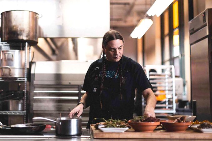 Chef Sean Sherman, also known as "The Sioux Chef," cooks in his Minneapolis-based kitchen.