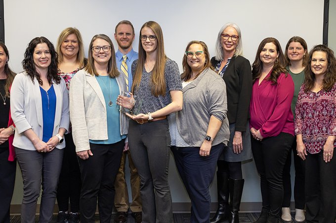 Staff of the Population Health Evaluation Center at South Dakota State University gather with South Dakota Department of Health representatives after the center was named the department's 2023 outstanding Partner in Health for the work the center does to support the department.