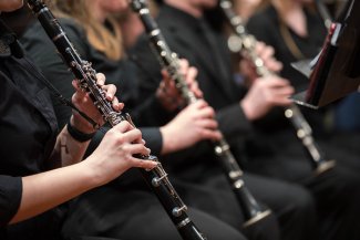 Three clarinets being played