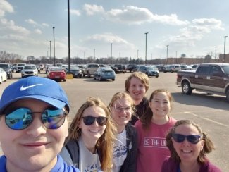 Six chemistry club members standing in the parking lot taking a selfie.
