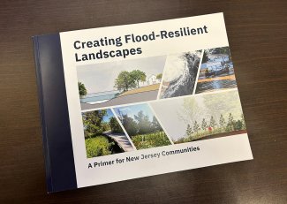 A copy of “Creating Flood Resilient Landscapes: A Primer for New Jersey Communities” on a table.