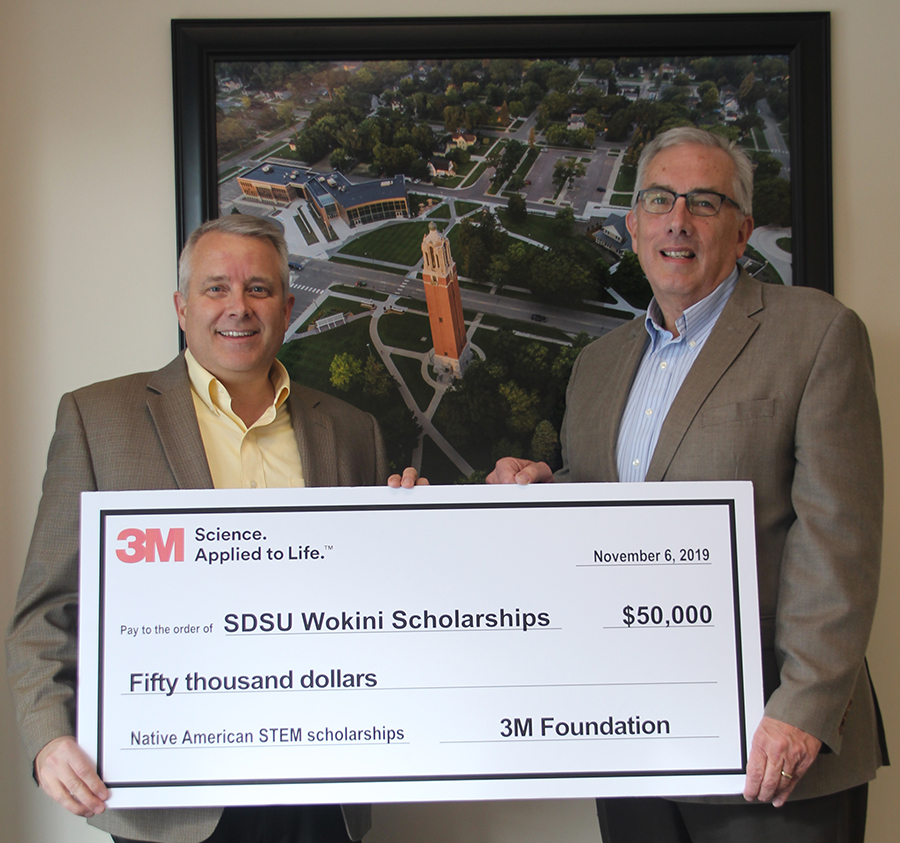 3M presents $50,000 check to President Dunn