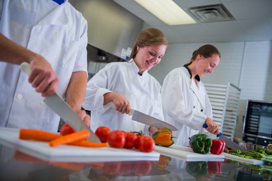 students chopping vegetables