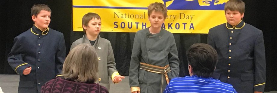 "Three NHD in SD students being interviewed about their historical performance by judges."