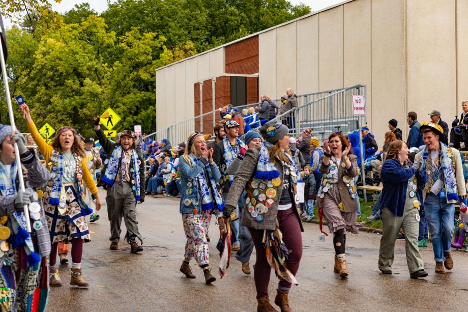 "The 18 student members of the 2019 Hobo Day Committee walk through Hobo Day Parade"