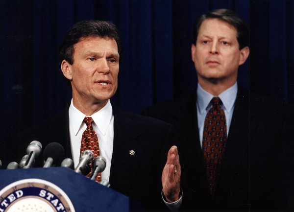 Senator Tom Daschle speaking at a podium with Vice-President Al Gore standing behind him. May 12, 1995. 