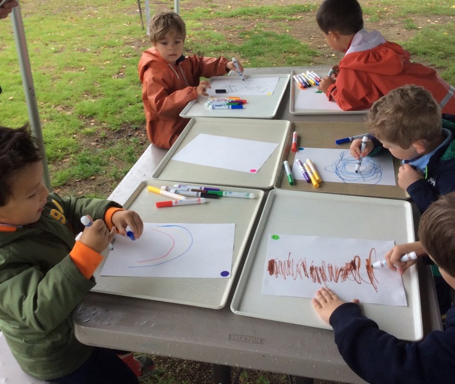 children drawing outside