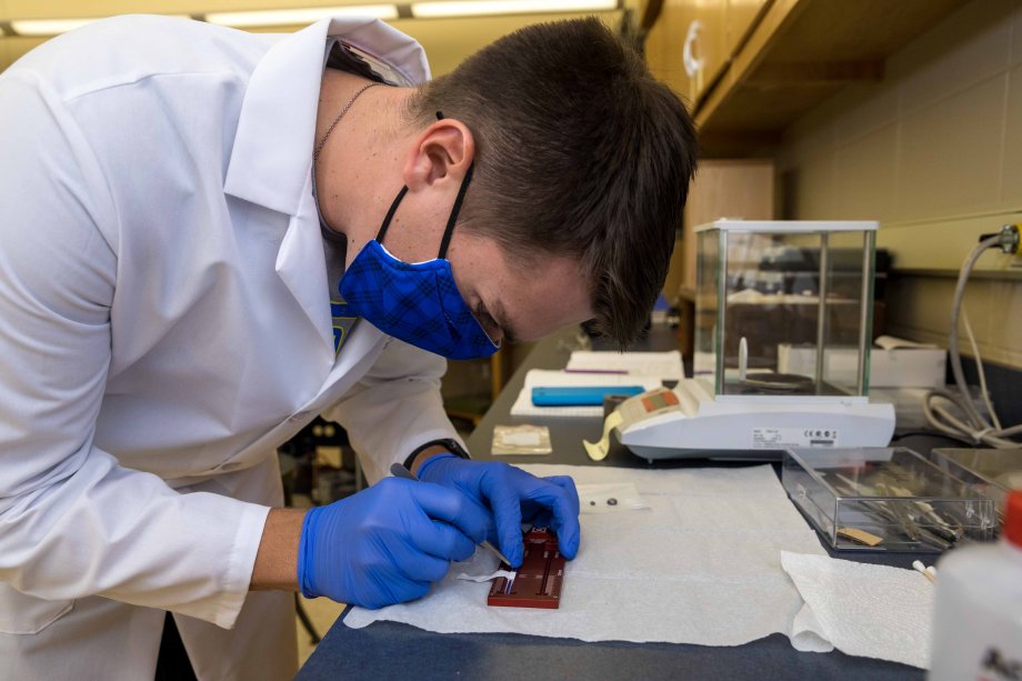 Zachary Lehmann mounting half-metallic alloy on sample holder