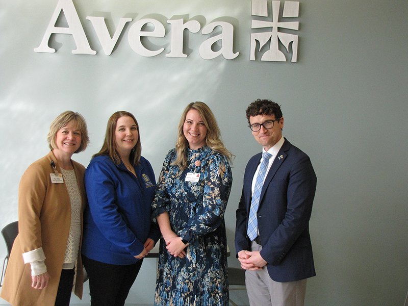 Gathering after the announcement of the Avera MLS Scholarship on the SDSU campus March 28 are, from left, Pam Hilber, director of workforce development at Avera; Stacie Lansink, director of the medical laboratory science program at SDSU; Jessica Deslauriers, lab quality and education manager at Avera; and Dan Hansen, dean of the College of Pharmacy and Allied Health Professions at SDSU.