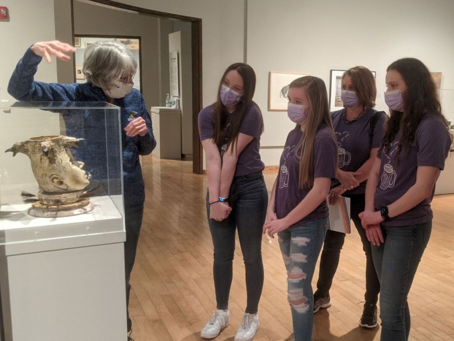 Students discussing artwork during a field trip at the South Dakota Art Museum