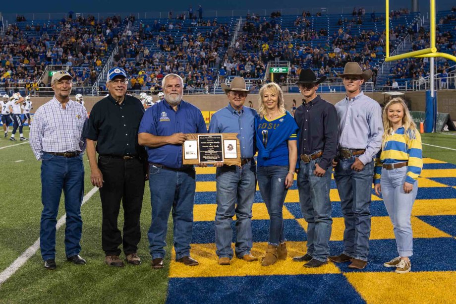 Representatives from The Cattle Business Weekly accepting the 2022 SDSU Friend of the Beef Industry Award.