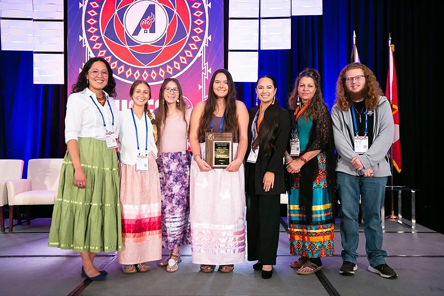The SDSU chapter accepts an award at the 2022 AISES National Conference.