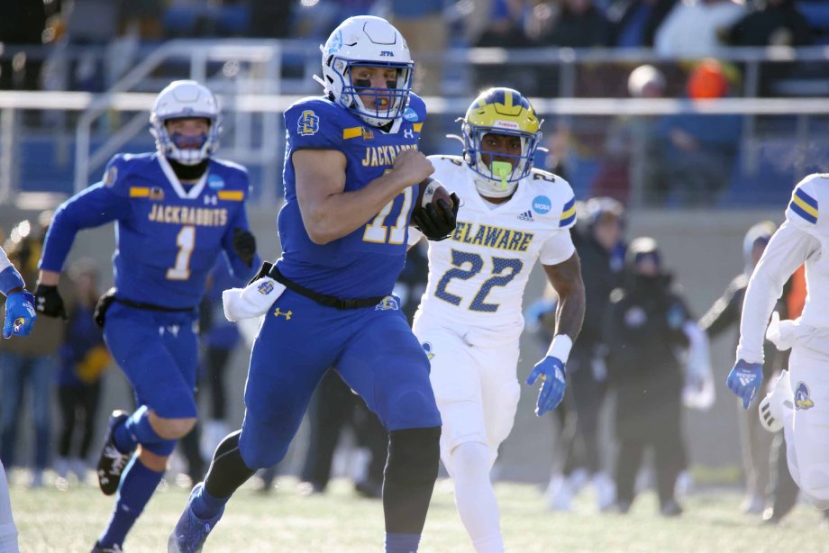 Mark Gronkowski breaks a 51-yard run up the middle in SDSU’s opening playoff game against Delaware Dec. 3. The mechanical engineering major was on the top of his game throughout the playoffs, including an MVP performance in the championship.
