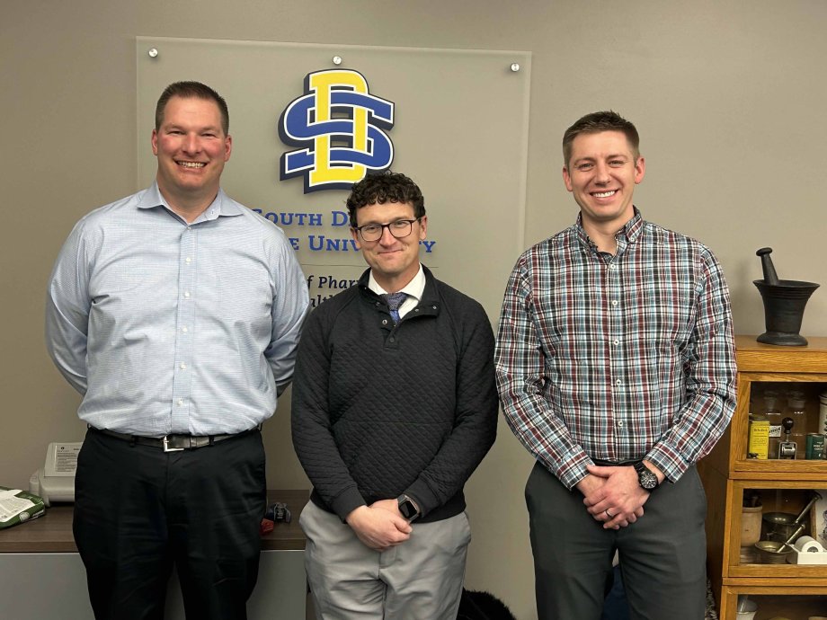 Dan Hansen, dean of the South Dakota State University College of Pharmacy and Allied Health Professions, is flanked by Jason Frederick, left, district manager with Walgreens in Sioux Falls, and Curt Orchard, health care supervisor for Walgreens’ Minnesota South region in Roseville.