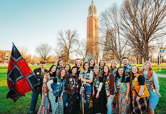 Group photo of the 2023 Hobo Day Committee in front of the Coughlin Campanile