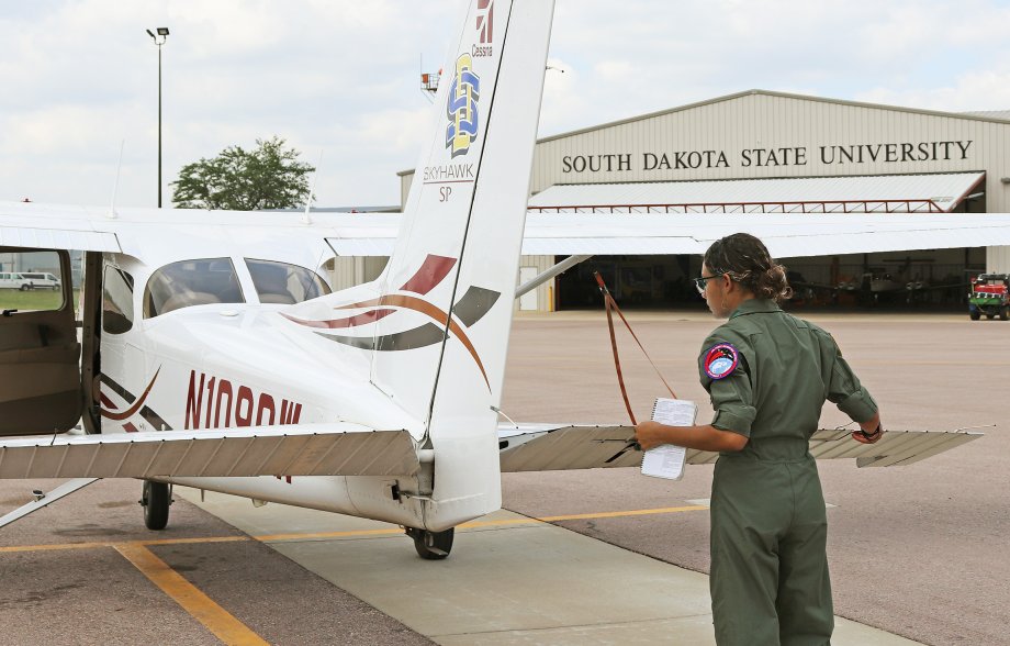 Aim High Flight Academy student Merceydez Patton of Muskegon, Michigan, goes through her preflight checklist on one of SDSU’s Cessna 172 Skyhawks at the Brookings Regional Airport.