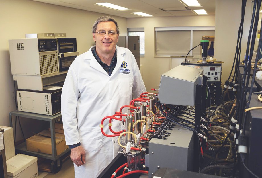 Bill Gibbons works in a lab on the South Dakota State University campus.