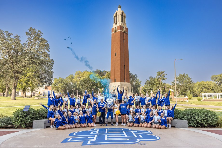 SDSU students, President Barry Dunn and Jack the Jackrabbit celebrate One Day for STATE in front of the Coughlin Campanile.