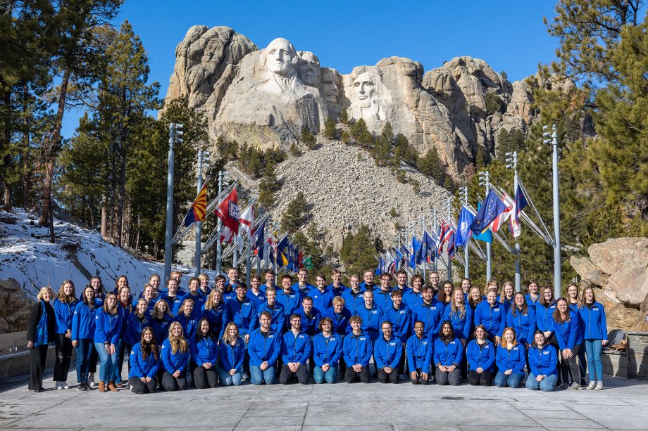 The SDSU Concert Choir takes a group photo at Mt. Rushmore.