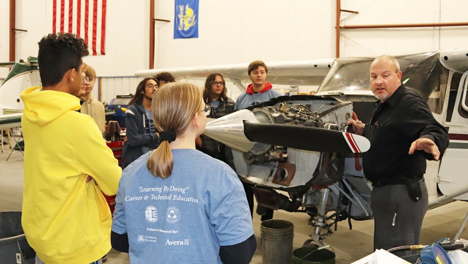 SDSU students, staff and faculty gave Career and Technical Education Academy students from Sioux Falls an overview of the university's aviation program during a site visit at the Brookings Regional Airport in October.