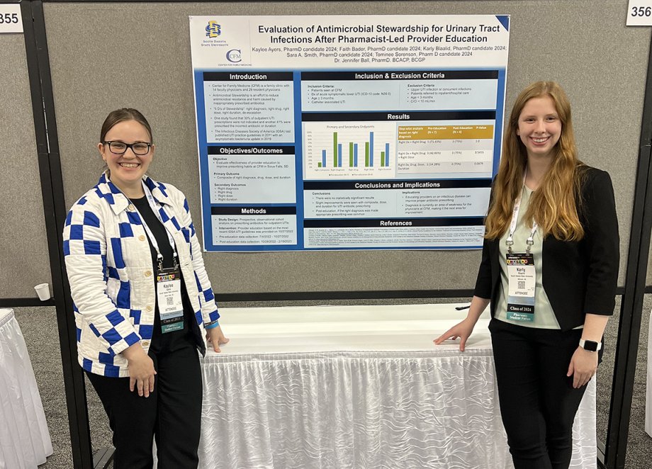 Kaylee Ayers and Karly Blaalid present their research poster at the