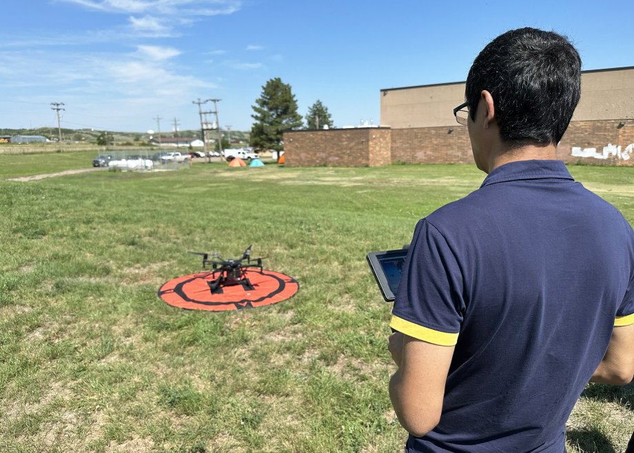 A participant flies a drone in the Lakota Uncrewed Aircraft Systems Program.