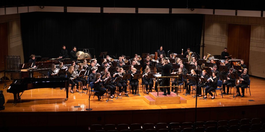The South Dakota Wind Symphony performs on stage in the Oscar Larson Performing Arts Center.