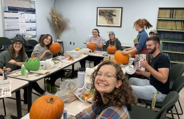 Botany Club carves/ paints pumpkins together to get into the Halloween spirit.
