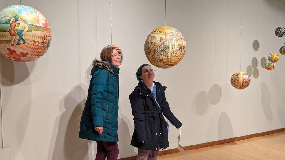 Visitors view the “Termespheres: Without Beginning or End” exhibition at the South Dakota Art Museum.