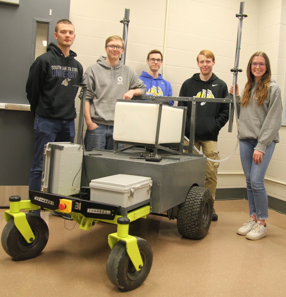 SDSU Robotics Club members who are part of the autonomous sprayer project team gather around the nearly completed sprayer Feb. 8, 2024. From left, are Draix Wyatt, Jonah Coffel, Tyler Loecker, Devin Hemmelman, and Haley Evenson. Not pictured is Cherish Stern.