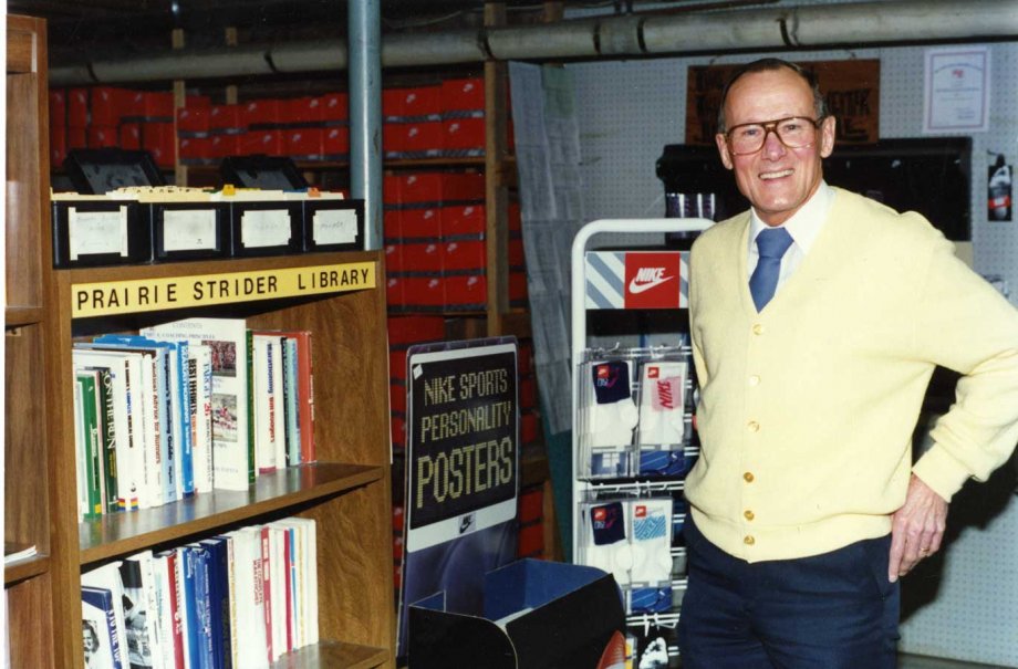 "Bob Bartling in front of the Prairie Striders Library, which was housed in the basement of Bartling's Furniture Store, 1991