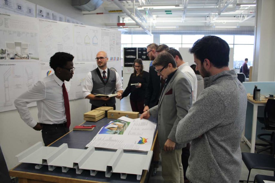 Students presenting PH02 to a reviewer panel. 