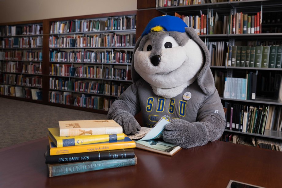 Jack the Jackrabbit studying in Briggs library