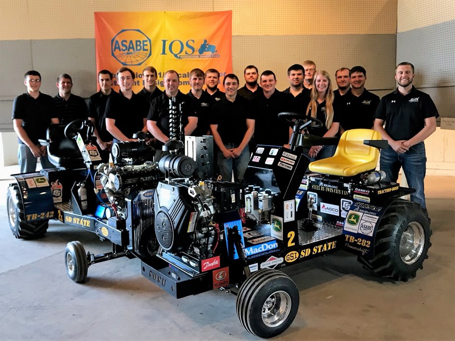 group picture of the 2018 team with their tractors