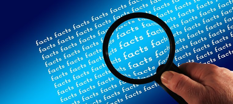 magnify glass over the word facts
