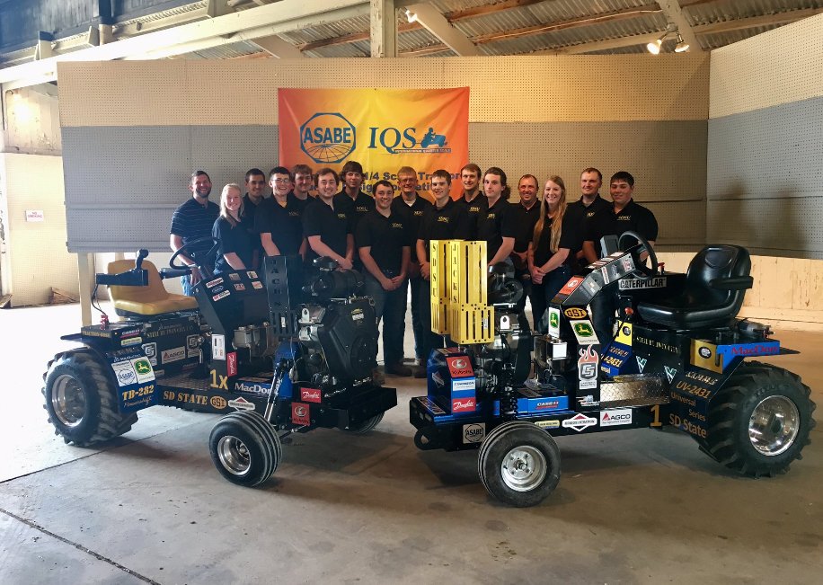 group picture of 2019 team with their tractors
