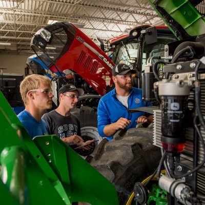 Students looking at an engine.
