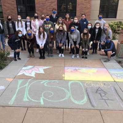 Honors Students pose by chalk art