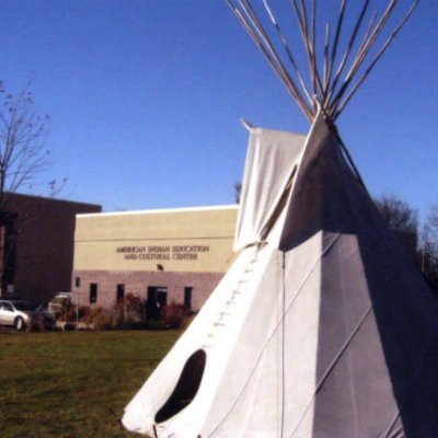 Image of a tipi in front of the American Indian Education and Cultural Center