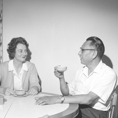 Heidi and Oscar Howe seated at their dining room table, ca 1960s