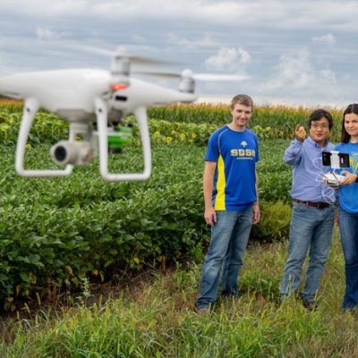 Ag Science students operating a drone in a soybean field