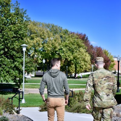 Two students walking outside
