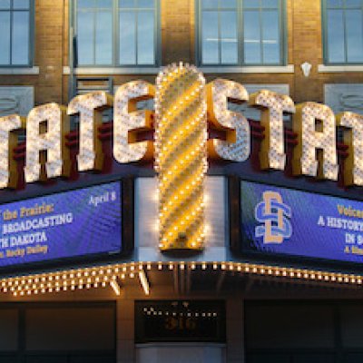 State theater with SDSU branding on digital display. 