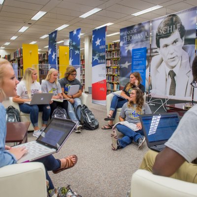 View of a group of students studying in the Hilton M Briggs Library.