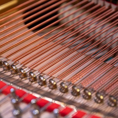 View of strings inside a piano.