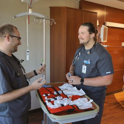 two SDSU respiratory care students in a hospital room